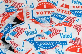 A pile of red, white, and blue "I Voted" stickers